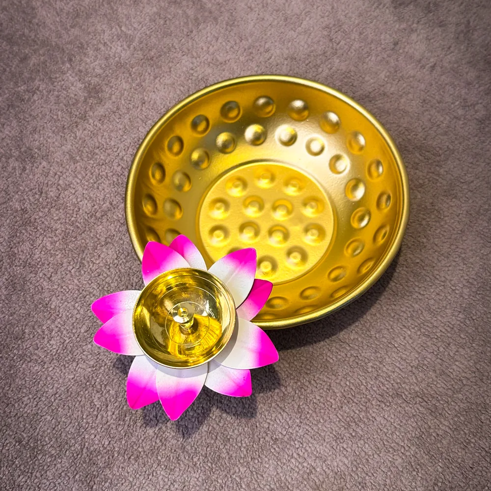 Pink lotus tealight diya with gold hammered urli plate — wholesale Diwali décor Moradabad